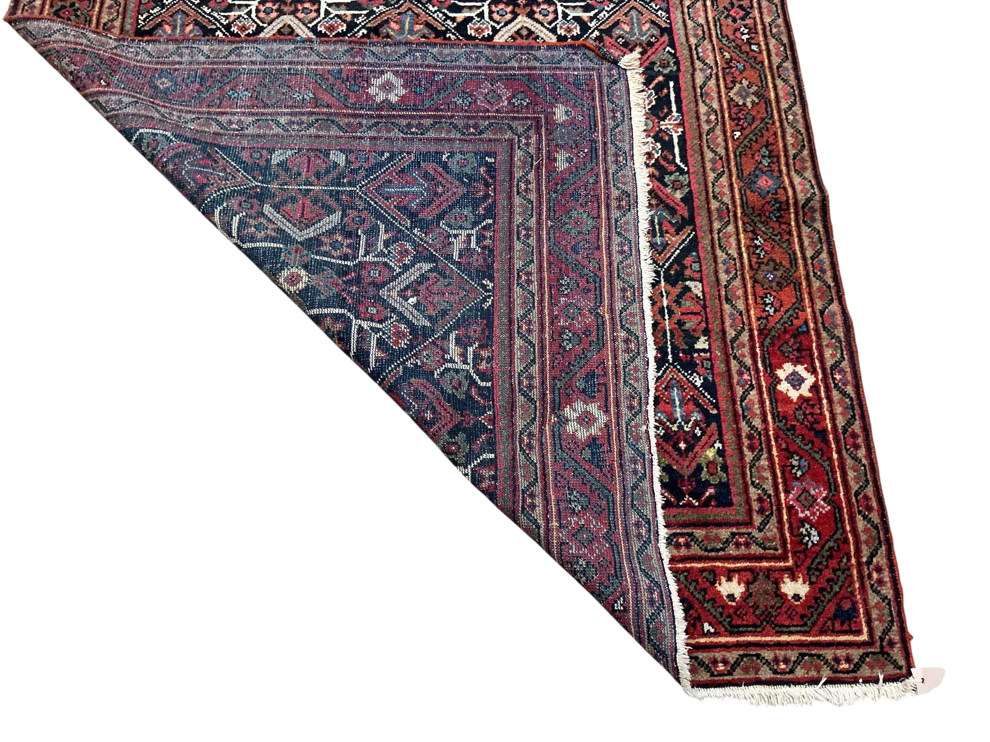 A North West Persian blue ground geometric rug, 210 x 140cm